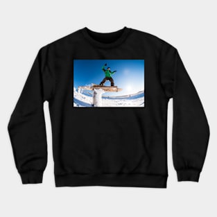 Snowboarder sliding on a rail Crewneck Sweatshirt